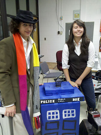Four and Sarah Jane Smith stand by the TARDIS.