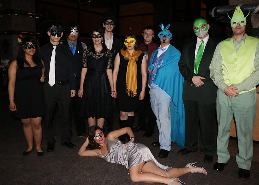 A group of fancy Pokemon outfits at the masquerade ball.