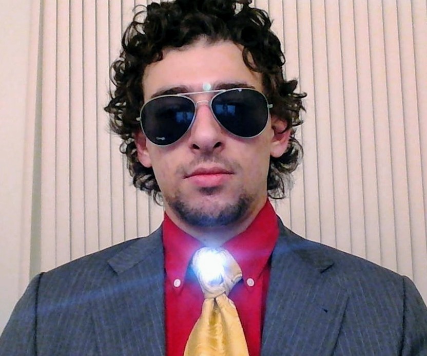 Tony Stark with a gray suit and red shirt.