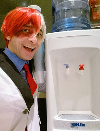 Shoto Todoroki poses with a water cooler with hot and cold water spouts.