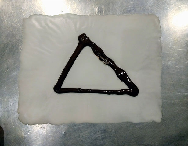 Close view of the dessert Scalene Triangle.